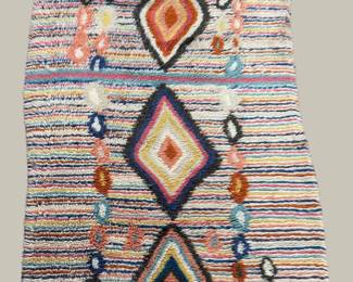 Multicolor striped rug with bold diamond medallions and tribal accents