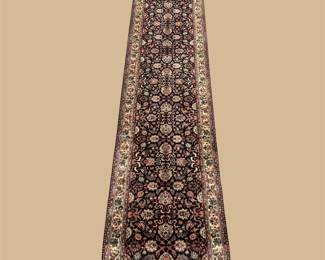 Narrow dark runner with repeating traditional motifs
