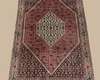 Deep burgundy rug with large diamond medallion