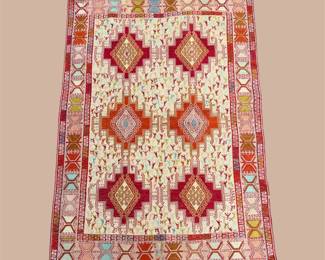 Ivory and red geometric rug with repeating diamond motifs