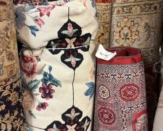 Mixed collection of decorative rugs with floral, geometric, and traditional patterns