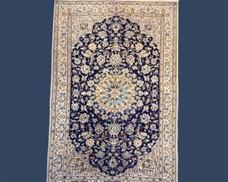 Navy and ivory traditional rug with ornate oval medallion