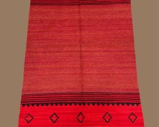 Vibrant red minimalist rug with black geometric border accents
