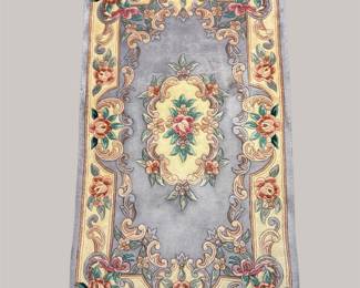 Ornate floral runner with soft blue field and traditional medallion design