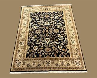 Black and ivory traditional area rug with ornate floral border