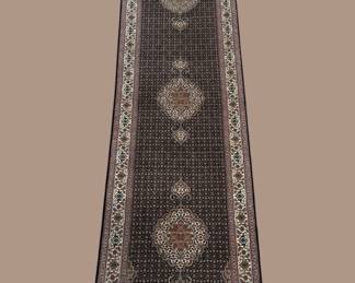 Long dark runner with repeating circular medallions