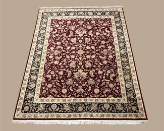 Burgundy and ivory traditional rug with dense floral field