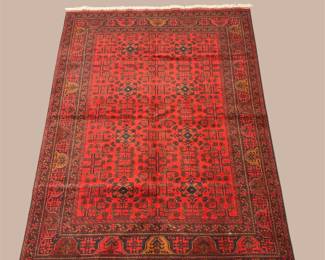 Deep red traditional rug with intricate all-over pattern