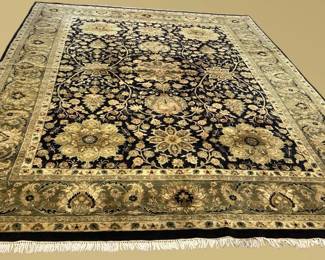 Black and gold floral rug with ornate botanical pattern and decorative border