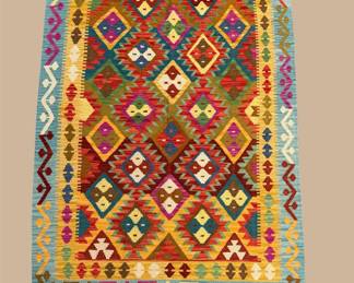 Bright multicolor geometric rug with bold diamond motifs