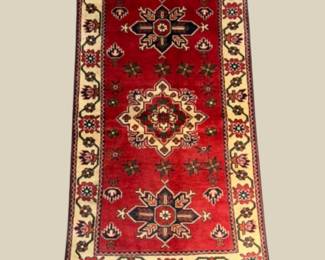 Rich red traditional rug with bold geometric medallions