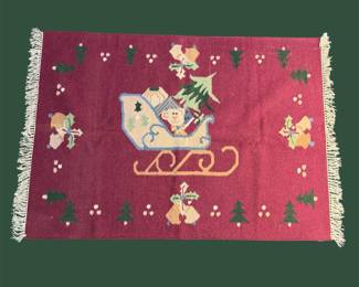 Small burgundy pictorial rug with decorative border