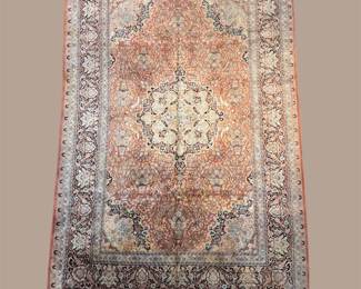 Soft ivory and rust traditional rug with faded central medallion