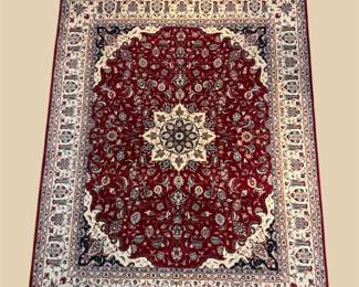 Burgundy and ivory oval rug with ornate central medallion