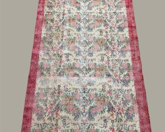 Soft ivory floral rug with red border and pastel detailing