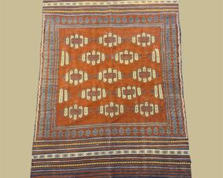 Rust and cream geometric rug with repeating oval motifs