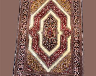 Brown and cream geometric rug with bold elongated medallion