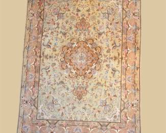 Soft pastel traditional rug with faded peach and blue detailing