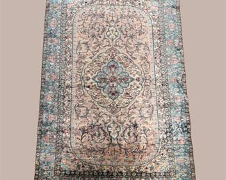 Soft pastel traditional rug with intricate faded detailing