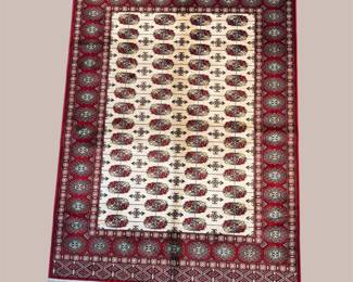 Burgundy and ivory traditional rug with repeating all-over motif