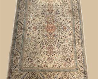 Ivory traditional rug with delicate floral pattern and ornate border