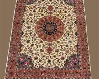 Ivory and burgundy rug with dramatic circular medallion