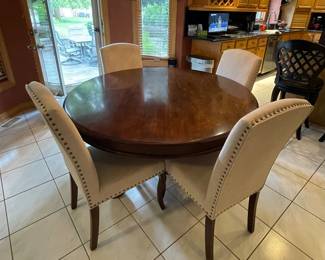 Solid wood dining table and 5 upholstered chairs, Table 53" across the top $400