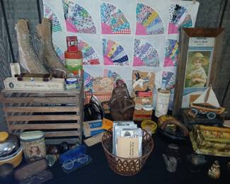 collection of vintage and antique treasures, including military collectibles, advertising tins, primitive wooden pieces, antique medical items