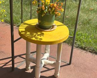 handmade PVC pipe tables with bright yellow tops