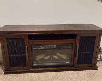 Dark Wood Media console with electric fireplace center