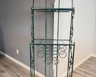 Green wrought-iron baker's rack