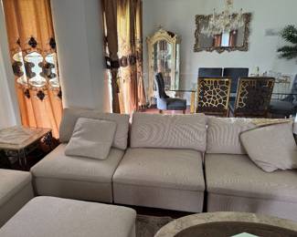 Cream Modular Sectional with 3 Ottomans – 9.5’ x 6.5’  Description:  Beautiful cream modular sectional sofa with three matching ottomans. Comfortable, modern design that can be arranged in multiple configurations to fit your space.  Dimensions:  * Long side: 9.5 ft (114”) * Short side: 6.5 ft (78”)  Includes:  * Modular sectional * 3 matching ottomans  Good condition. Smoke-free home. Perfect for a living room, family room, or media room.