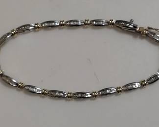 14kt white gold and diamond with 14kt yellow gold accents.