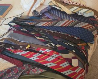 Large collection of men's neckties, including classic and designer styles, perfect for work, formal wear, and collectors. Discover quality men's clothing and accessories at this Tavares, FL estate sale by Kinfolk Estate Sales.