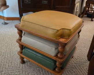 Vintage stacking wooden footstools with upholstered cushions in coordinating colors. Versatile accent furniture perfect for extra seating, footrests, or home décor, available at this Tavares, Florida estate sale hosted by Kinfolk Estate Sales.