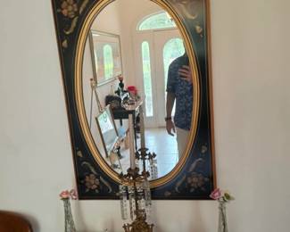 Elegant Ethan Allen oval wall mirror featuring a hand-painted floral frame and classic traditional styling. A beautiful statement piece for an entryway, dining room, or bedroom, available at this Tavares, Florida estate sale hosted by Kinfolk Estate Sales.