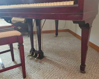 Beautiful baby grand piano with matching bench, a standout feature of this Tavares, Florida estate sale. An elegant instrument and timeless addition for musicians, collectors, and fine home décor enthusiasts. Hosted by Kinfolk Estate Sales.