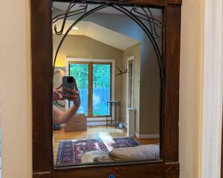 Antique carved wood wall mirror.