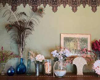 Peacock feathers and vases