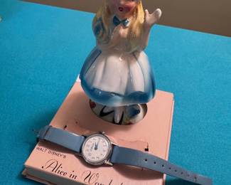 Vintage Alice in Wonderland figurine with watch