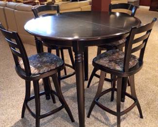 Pub style table with four chairs and...