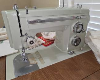 Convertible sewing table with a Sears sewing machine