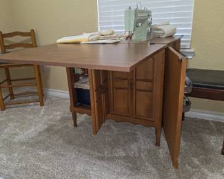 Convertible sewing table with a Sears sewing machine