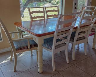 Dining table with 1 leaf and 6 matching chairs