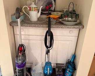 variety of vacuums and kitchen items