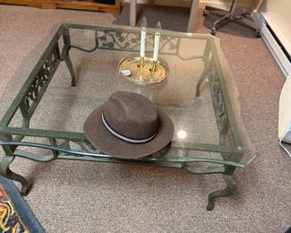 Solid cast metal coffee table with plate glass top
