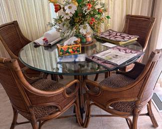 Bamboo and rattan glass topped table and 4 chairs - cushions in animal print
