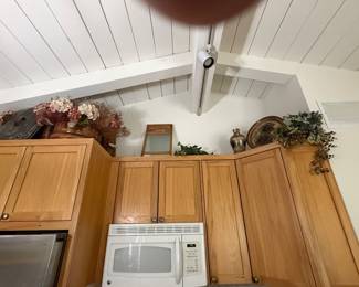Copper pots, faux plants, decor