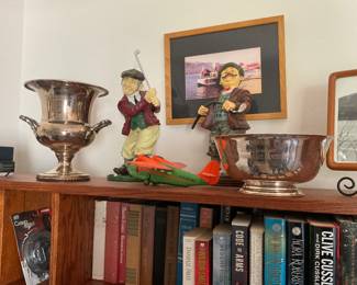 Golf trophies and decor, books