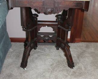 Marble top parlor table, ornate base